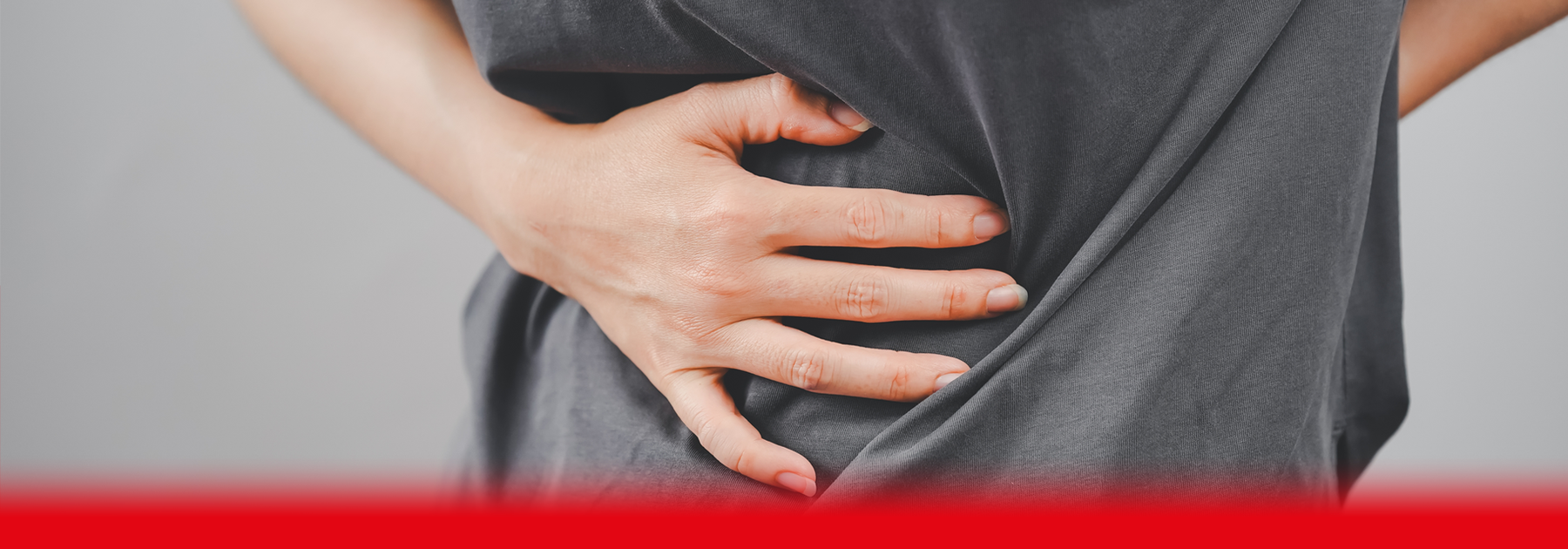 woman holding her side