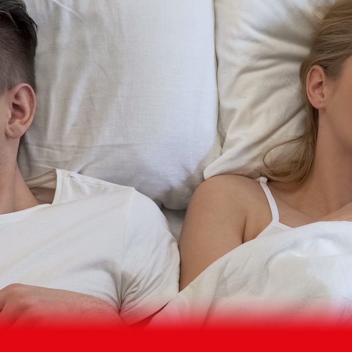 couple in bed dissapointed