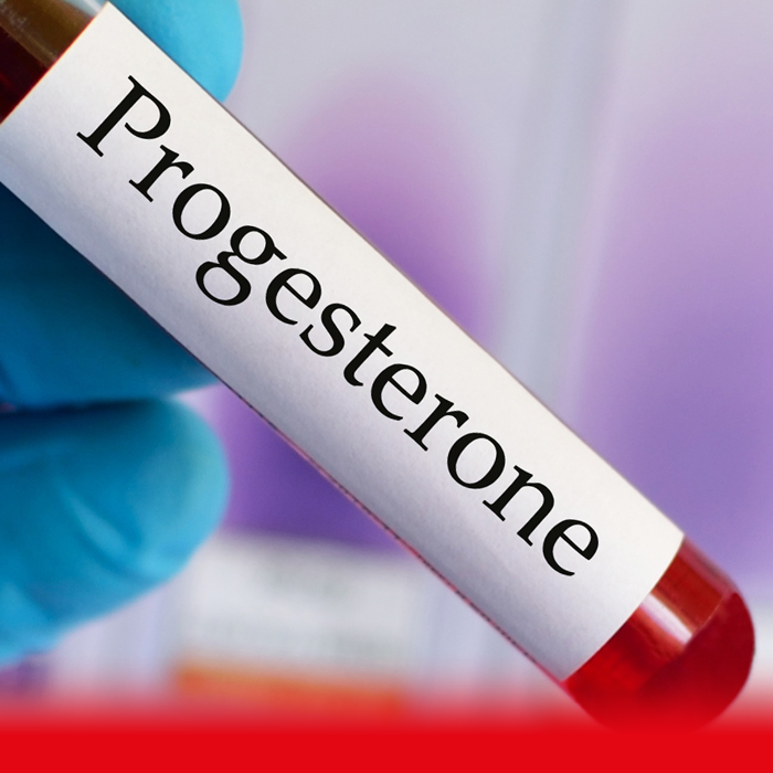 doctor holding progesterone tube