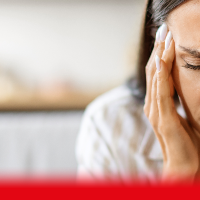 woman holding her head
