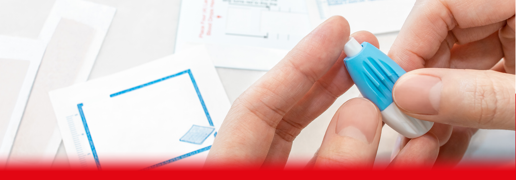 patient taking finger prick test at home