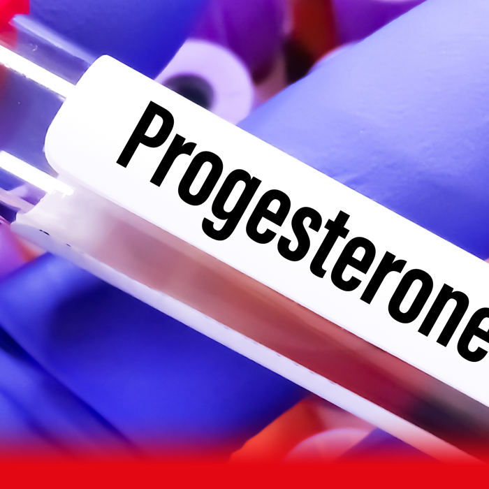 doctor holding tube labelled progesterone