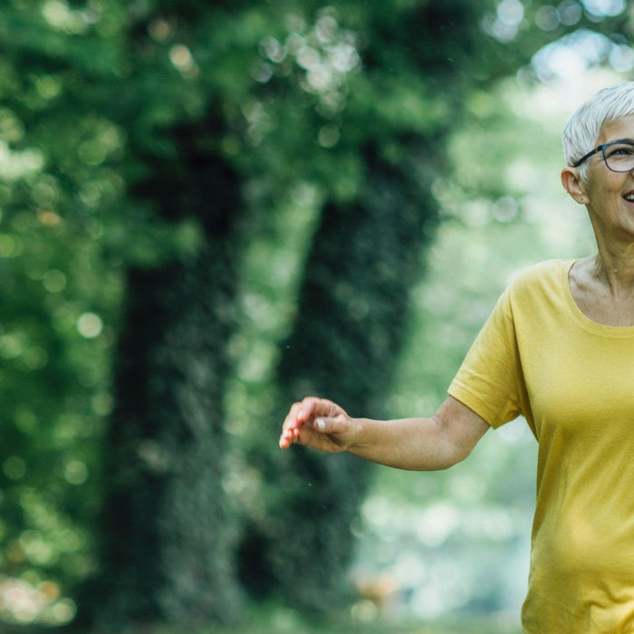 Woman walking in forest