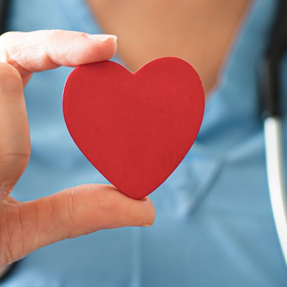 Nurse holding a heart