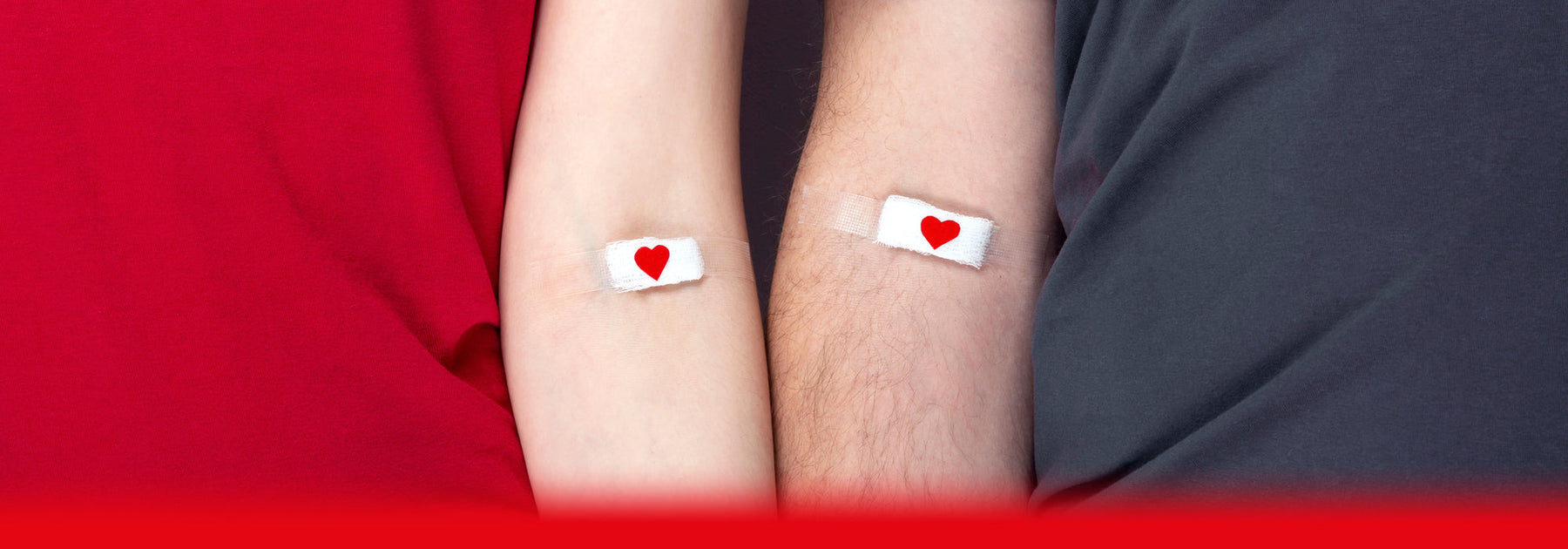 man and woman with plasters on after a blood test