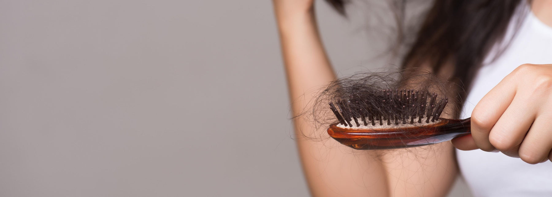 Woman inspecting her scalp