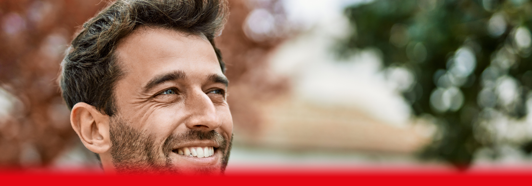 man smiling outdoors