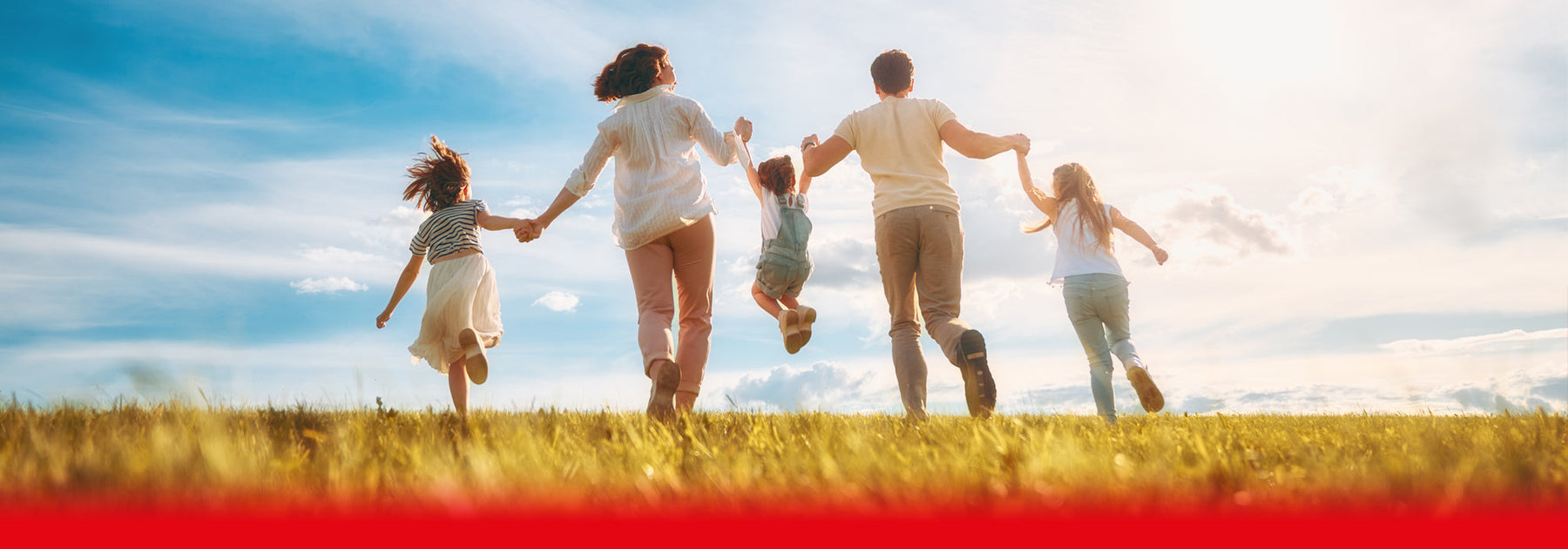 family playing in the sun