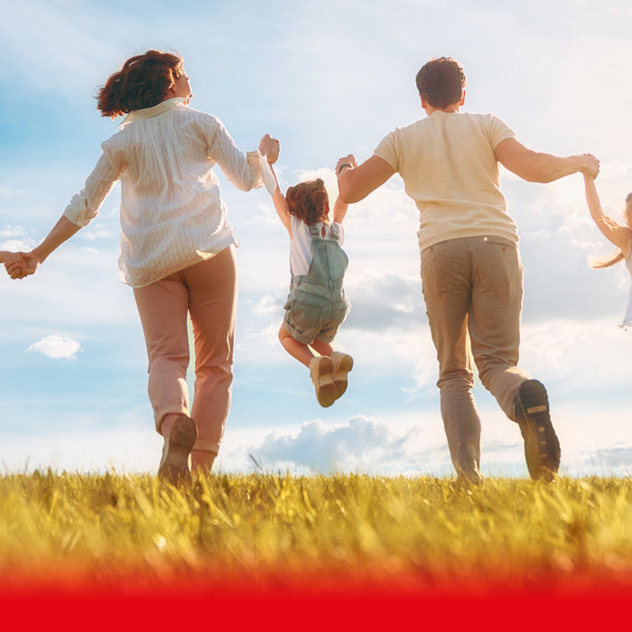family playing in the sun
